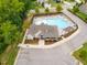 Aerial view of community pool, pool house, lounge chairs and manicured landscaping at 401 Molina Ct, Rolesville, NC 27571
