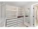 Well-organized walk-in closet with built-in shelving and drawer space at 401 Molina Ct, Rolesville, NC 27571