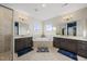 Bathroom with dual vanities, granite countertops, soaking tub, and walk-in shower at 416 Holding Creek Dr, Wake Forest, NC 27587