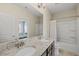 Stylish bathroom featuring double sinks, granite countertops, and a shower-tub combination at 416 Holding Creek Dr, Wake Forest, NC 27587