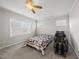 Cozy bedroom features a ceiling fan and a comfortable quilted bed at 416 Holding Creek Dr, Wake Forest, NC 27587