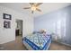 Serene bedroom with blue accent wall and access to the en-suite bathroom at 416 Holding Creek Dr, Wake Forest, NC 27587