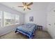 Bright bedroom with lilac walls, ceiling fan, and a window providing natural light at 416 Holding Creek Dr, Wake Forest, NC 27587