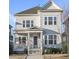 Charming two-story home with a covered front porch, large windows, and manicured landscaping at 416 Holding Creek Dr, Wake Forest, NC 27587