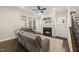 Bright living room with a fireplace, built-in shelves, and a comfortable seating area at 416 Holding Creek Dr, Wake Forest, NC 27587