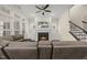 Inviting living room featuring a fireplace, built-in shelves, and staircase access at 416 Holding Creek Dr, Wake Forest, NC 27587