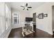 Home office featuring a stand-up desk, ceiling fan, and a window for natural light at 416 Holding Creek Dr, Wake Forest, NC 27587