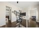 Open office layout featuring a modern chair, sit stand desk and hardwood floors at 416 Holding Creek Dr, Wake Forest, NC 27587