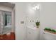Cozy bathroom with white vanity, decorative plants, and a well-lit mirror; storage within easy reach at 4601 Timbermill Ct # 302, Raleigh, NC 27612