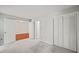 Bright bedroom with closet and doorway to living room at 4601 Timbermill Ct # 302, Raleigh, NC 27612