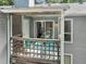 Spacious deck with wooden railing, chairs, table, and trees in view at 4601 Timbermill Ct # 302, Raleigh, NC 27612
