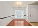 Bright entryway with hardwood floors, a window, and a white entry door at 4601 Timbermill Ct # 302, Raleigh, NC 27612