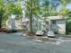 Condo complex with well-maintained landscaping, ample parking, and attractive building exteriors, showcasing a desirable community at 4601 Timbermill Ct # 302, Raleigh, NC 27612