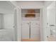 Convenient laundry closet with shelving, washer, and dryer at 4601 Timbermill Ct # 302, Raleigh, NC 27612