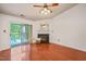 Bright living room with fireplace, ceiling fan, and sliding door to balcony at 4601 Timbermill Ct # 302, Raleigh, NC 27612