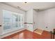 Bright living room with hardwood floors and large window with blinds at 4601 Timbermill Ct # 302, Raleigh, NC 27612