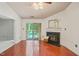 Spacious living room with fireplace, ceiling fan, and access to outdoor balcony at 4601 Timbermill Ct # 302, Raleigh, NC 27612