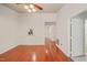 Bright living room with ceiling fan and view to hallway and kitchen at 4601 Timbermill Ct # 302, Raleigh, NC 27612