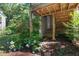 Underdeck view shows wooden stairs and landscaping at 4601 Timbermill Ct # 302, Raleigh, NC 27612
