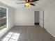 Bedroom has a ceiling fan, closet, carpet, view out window to the exterior at 5605 Christie Ln, Durham, NC 27713