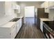 Clean kitchen with stainless steel appliances and white cabinets at 5605 Christie Ln, Durham, NC 27713