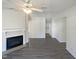 Spacious living room with a fireplace and neutral tones throughout at 5605 Christie Ln, Durham, NC 27713