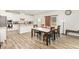 Dining area with a marble table and seating for six, plus a sliding door to the backyard at 609 Embrun Run, Wendell, NC 27591