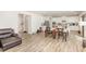 Open concept living and dining area with light wood floors and lots of natural light at 609 Embrun Run, Wendell, NC 27591