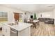 Open concept space with kitchen, dining area, and living room, perfect for entertaining at 609 Embrun Run, Wendell, NC 27591