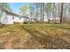 Large backyard with deck and storage shed on the property at 6208 Silver Spring Ct, Willow Springs, NC 27592