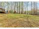 Lush backyard with mature trees at 6208 Silver Spring Ct, Willow Springs, NC 27592