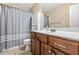Cozy bathroom with ample vanity storage, white countertop and a shower-tub combo at 6208 Silver Spring Ct, Willow Springs, NC 27592