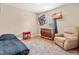 Comfortable bedroom with wood floors, recliner, and a TV at 6208 Silver Spring Ct, Willow Springs, NC 27592