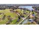 Expansive aerial view of lakefront neighborhood, and farm land on a sunny day at 749 Hadrian Dr, Garner, NC 27529