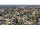 Expansive aerial view of a neighborhood with lush trees and winding roads near a lake at 749 Hadrian Dr, Garner, NC 27529