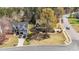 Charming house surrounded by a well-manicured lawn, lush trees, and a serene residential neighborhood at 749 Hadrian Dr, Garner, NC 27529