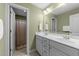 Bathroom featuring a dual sink vanity, large mirror, and shower with curtain at 749 Hadrian Dr, Garner, NC 27529