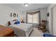 Bright bedroom with vintage chair, classic furnishings, and large window at 749 Hadrian Dr, Garner, NC 27529