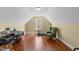 Attic bonus room featuring a workspace with hard wood floors and lots of sunlight at 749 Hadrian Dr, Garner, NC 27529
