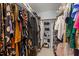 Walk-in closet featuring built-in shelving and rods for ample storage at 749 Hadrian Dr, Garner, NC 27529