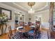 Dining room featuring a chandelier, dining table, and doorway to the living room at 749 Hadrian Dr, Garner, NC 27529