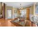 The dining room features a glass table with seating for four at 749 Hadrian Dr, Garner, NC 27529