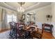 Dining room with elegant chandelier, hardwood floors, and a view to front rooms at 749 Hadrian Dr, Garner, NC 27529