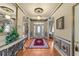 Elegant foyer with hardwood floors, decorative rug, and a stylish console table at 749 Hadrian Dr, Garner, NC 27529