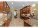 Spacious kitchen features granite countertops and custom wood cabinetry at 749 Hadrian Dr, Garner, NC 27529