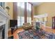 Inviting living room with two-story ceilings and large windows at 749 Hadrian Dr, Garner, NC 27529