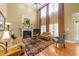 Bright living room with high ceilings, hardwood floors, and a cozy fireplace at 749 Hadrian Dr, Garner, NC 27529