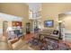 Open-concept living room with a fireplace and elegant decor at 749 Hadrian Dr, Garner, NC 27529
