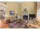 Bright living room with fireplace, hardwood floors and neutral paint at 749 Hadrian Dr, Garner, NC 27529