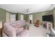 Relaxing living room with comfortable seating, a TV, and access to other rooms at 749 Hadrian Dr, Garner, NC 27529